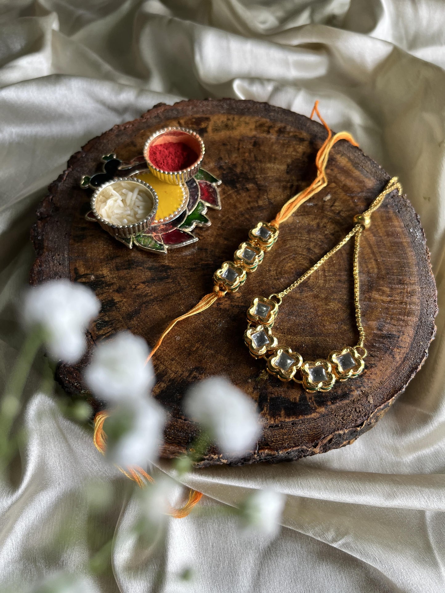 Glorious square Kundan Rakhi Lumba set Florenzaa