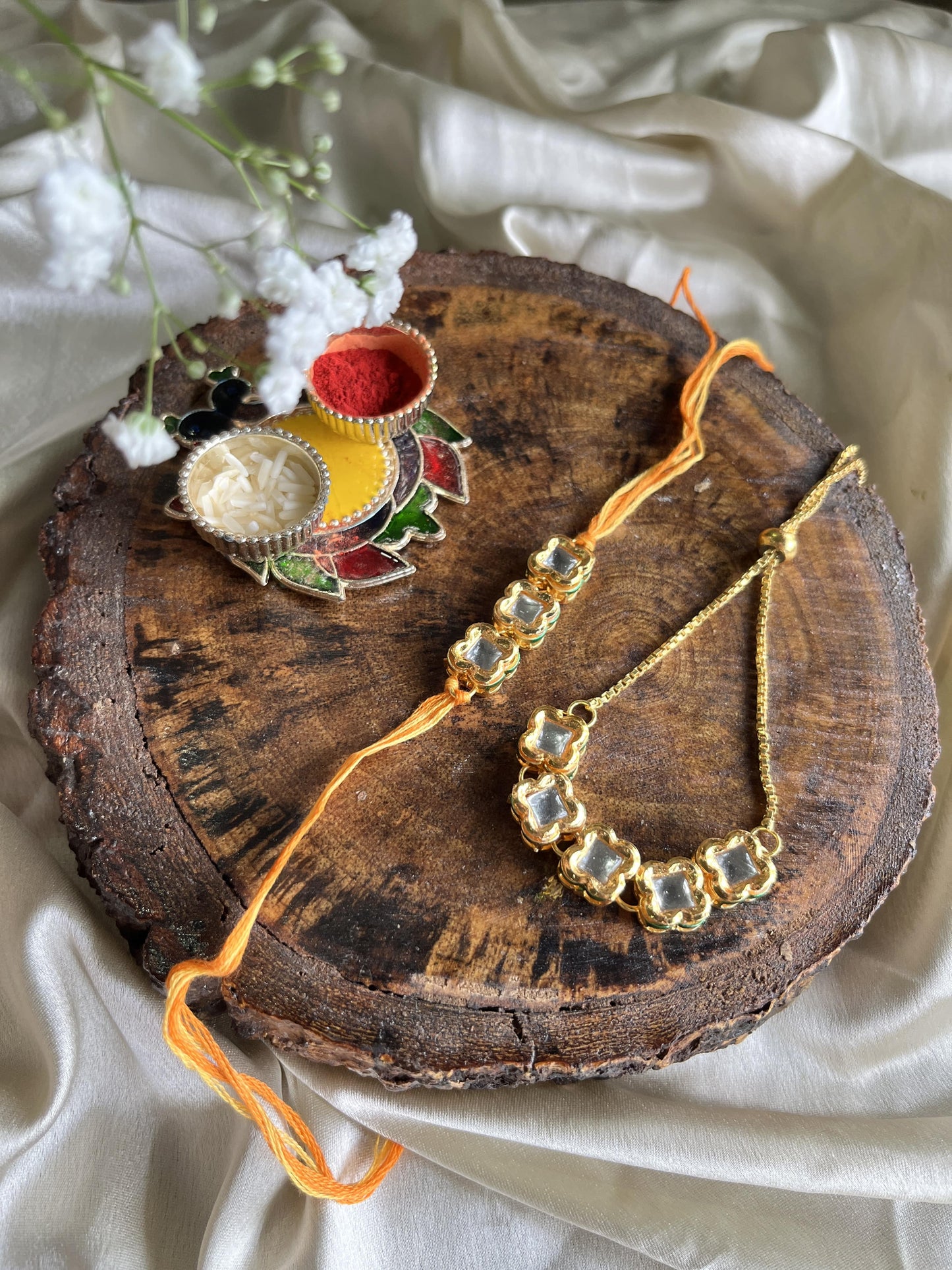 Glorious square Kundan Rakhi Lumba set Florenzaa