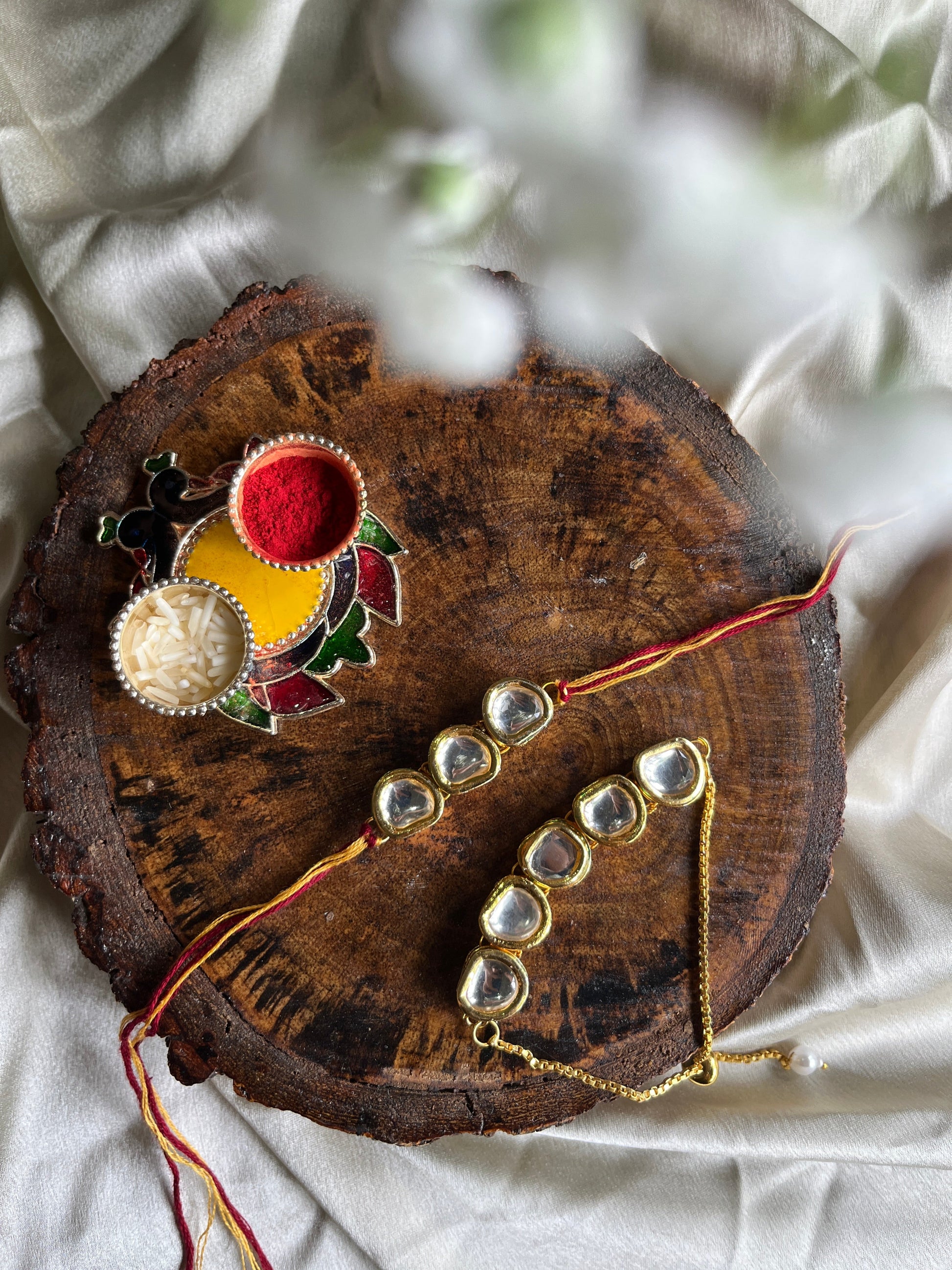 Glorious round Kundan Rakhi Lumba set Florenzaa