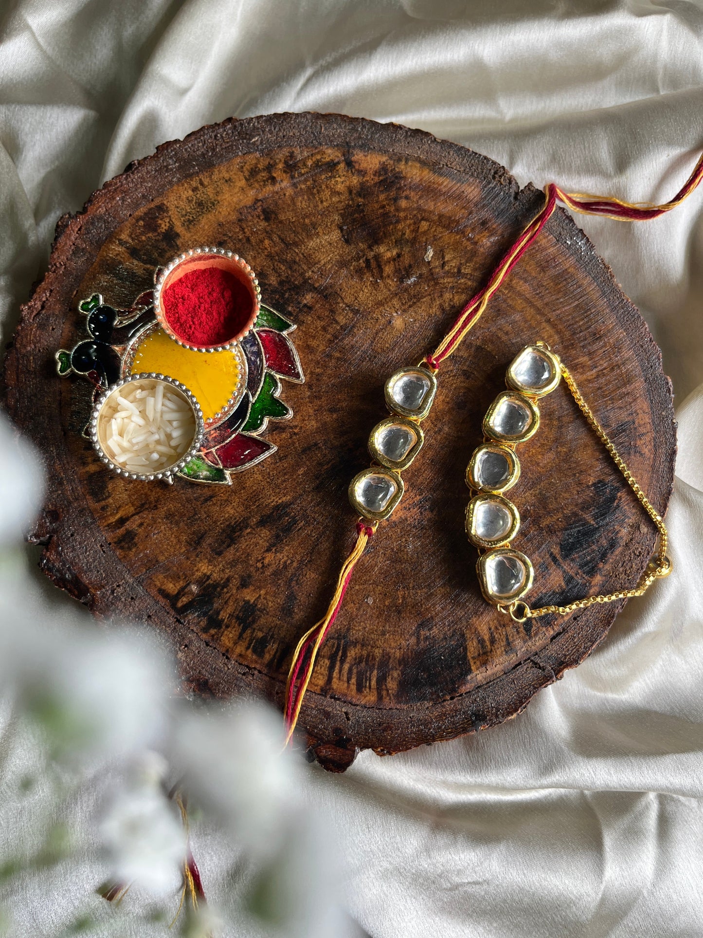 Glorious round Kundan Rakhi Lumba set Florenzaa